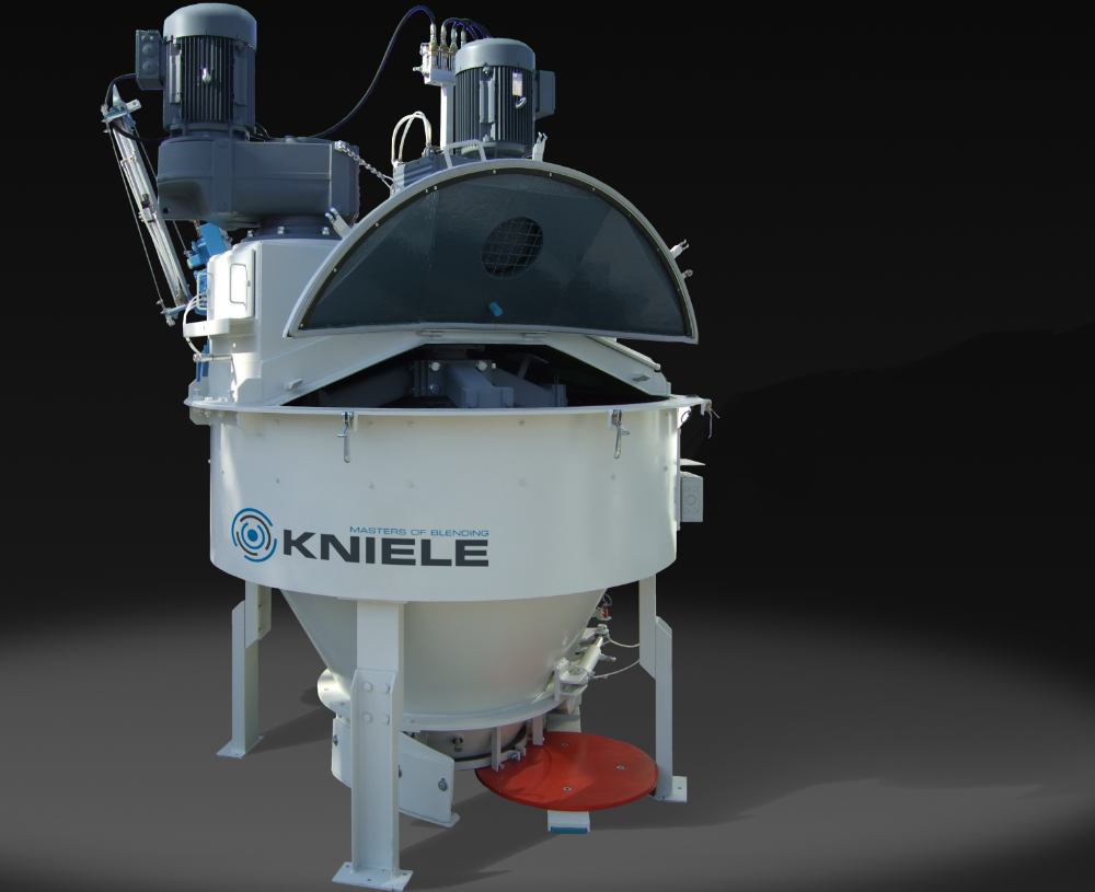 White Kniele cone mixer for concrete with two attached motors and open mixer cover.