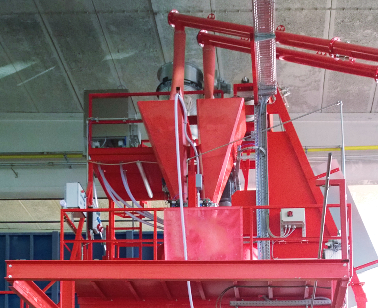 Red mixer platform with cement scale, feed elevator and cement screws from the right.